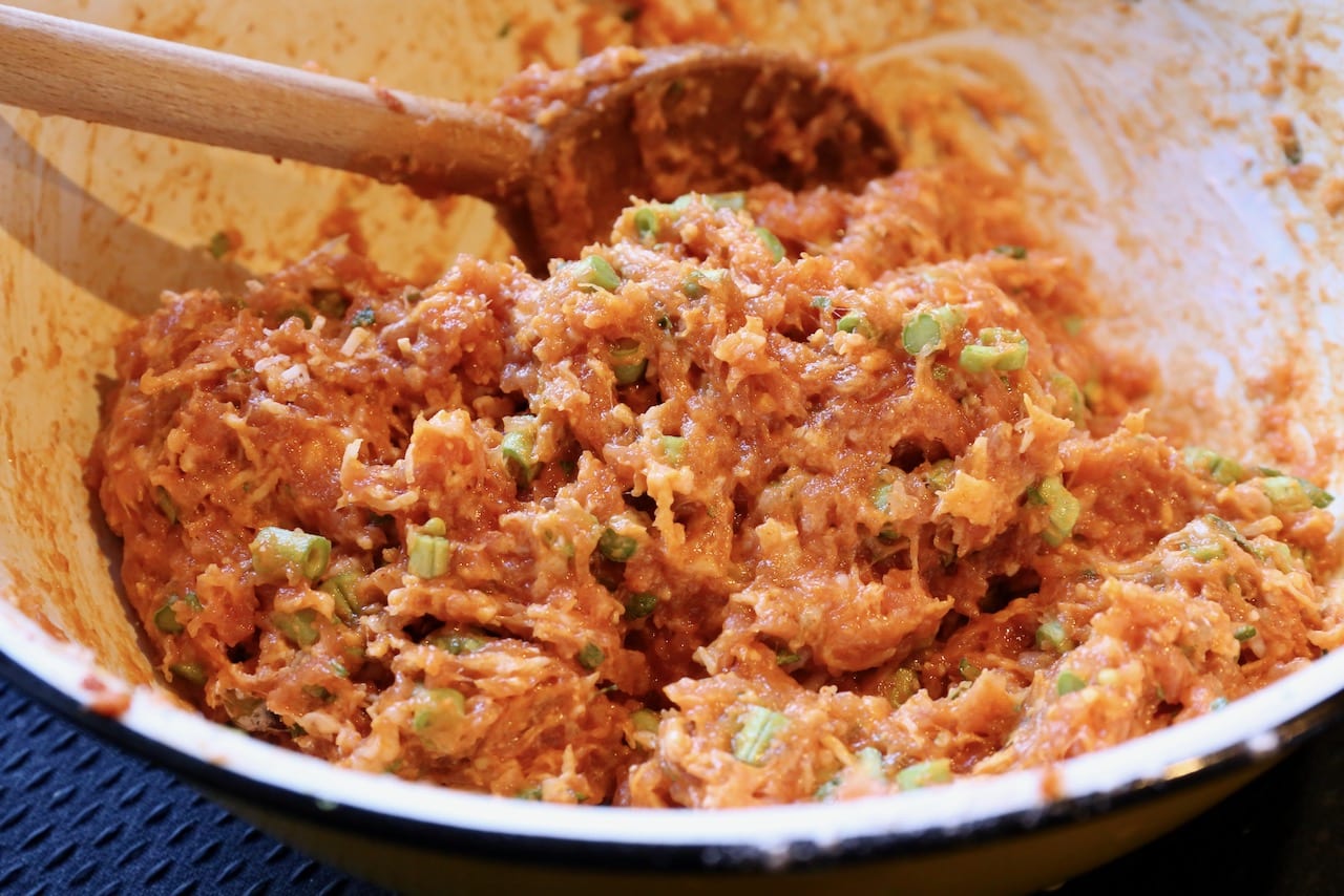 Combine the meatball ingredients in a large mixing bowl.