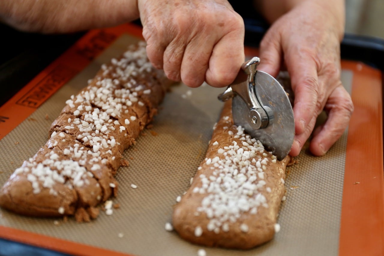 Use a pizza cutter to slice the cookies immediately after they are removed from the oven.