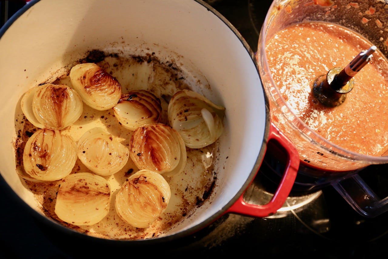 Roast onions in a large dutch oven until caramelized and browned. 