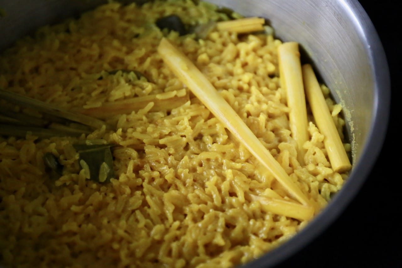 Cook Indonesian Yellow Rice in a large skillet with a lid. 