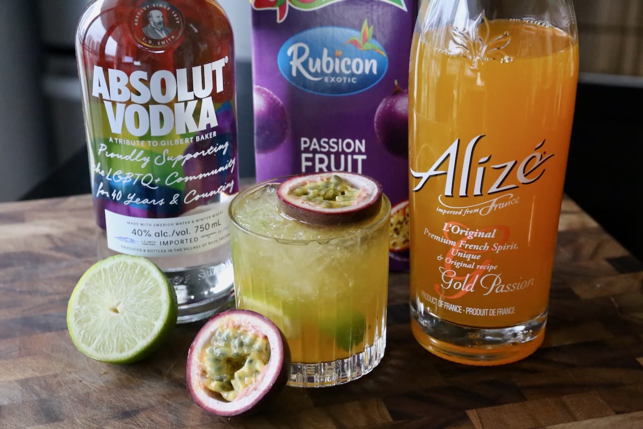 Serve this refreshing Caipiroska cocktail over crushed ice and topped with a sliced Passion Fruit. 