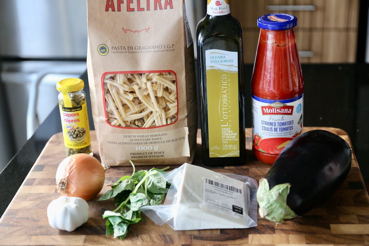 Traditional Sicilian Casarecce alla Norma recipe ingredients.