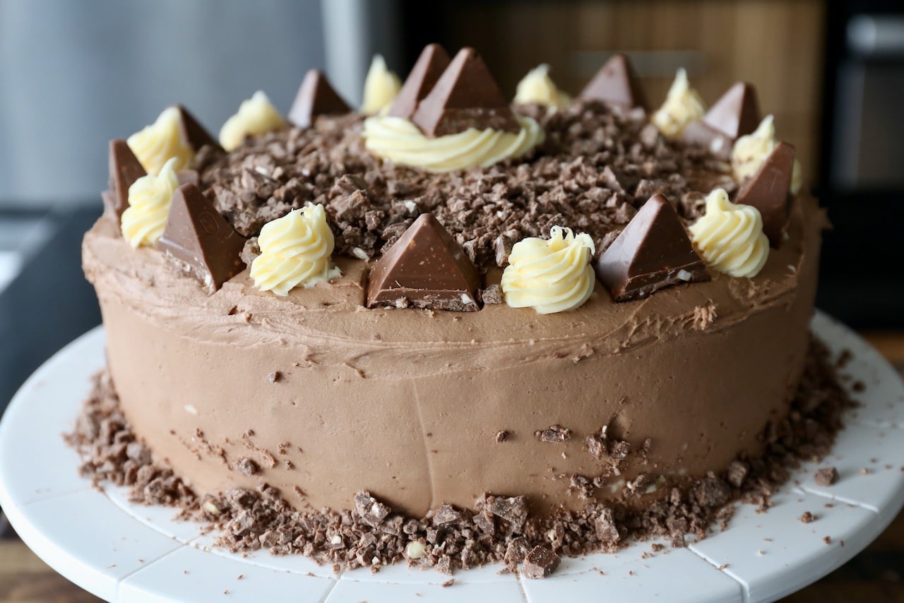 This cake features 2 layers of chocolate sponge cake and filled with buttercream icing.