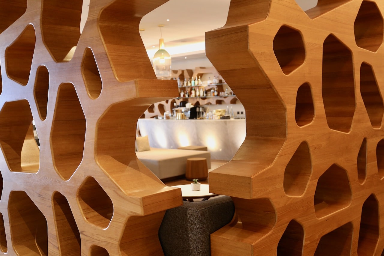 A Lounge has eye-catching walls that look like honeycomb.