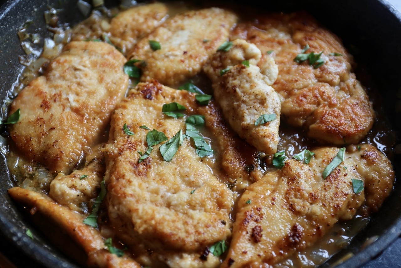 Pan-fry floured chicken cutlets in a skillet until tender.