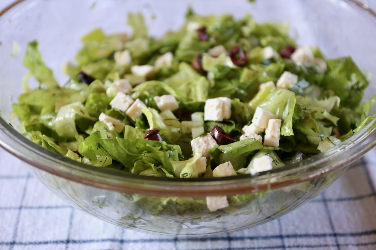 Toss Maroulosalata in a large salad bowl.