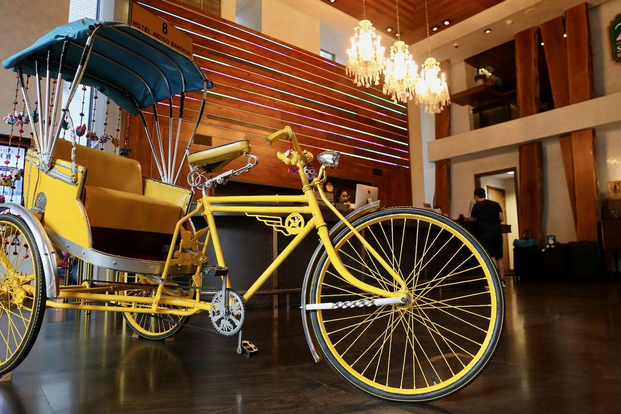 A tuk tuk greets guests at the Hotel Indigo Bangkok Wireless Road lobby.