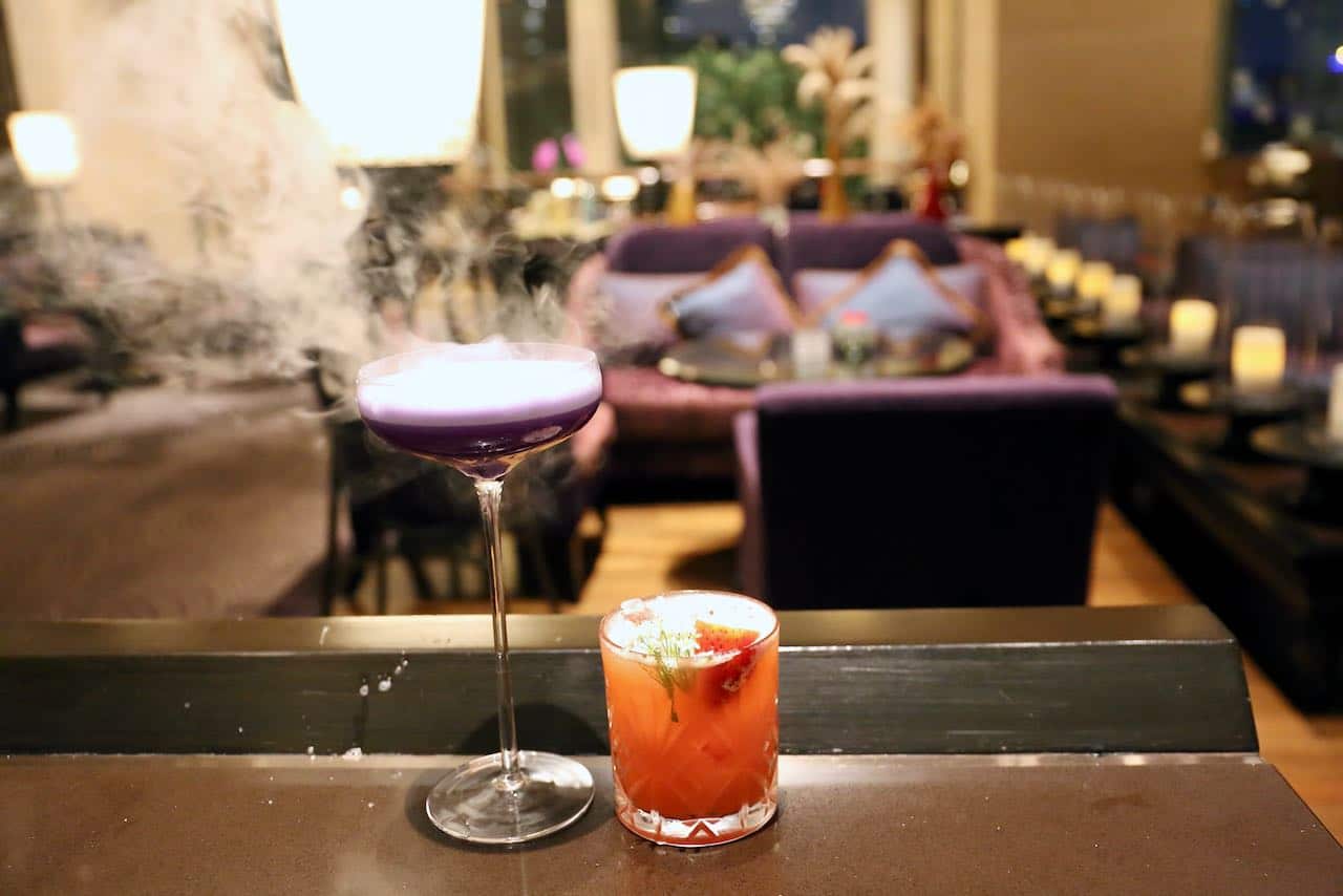 Talented mixologists at The Long Bar shake up eye-popping craft cocktails.