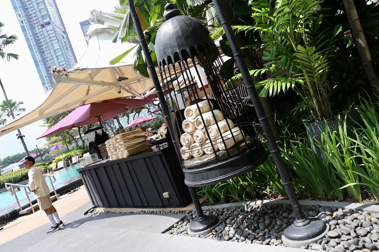 Visit the pool and you'll find towels stored in a stunning bird cage. 