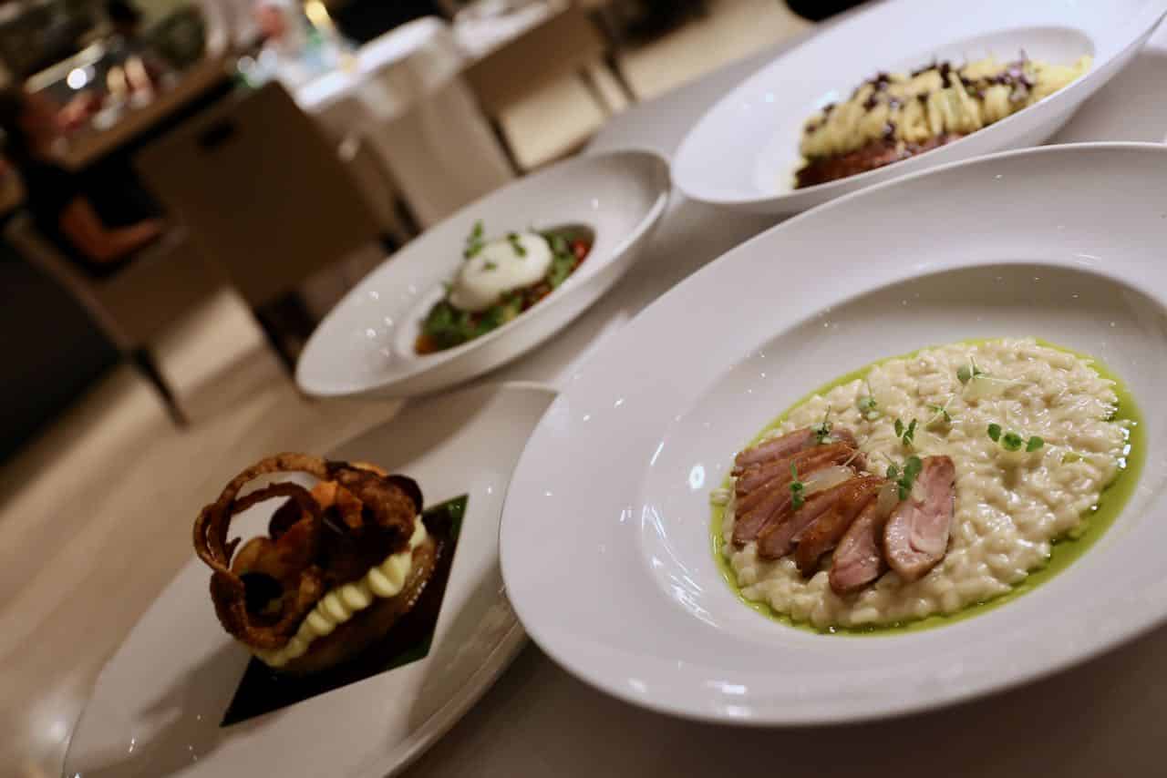 Enjoy a romantic Italian feast at Volti Tuscan Grill featuring risotto, pasta and burrata. 