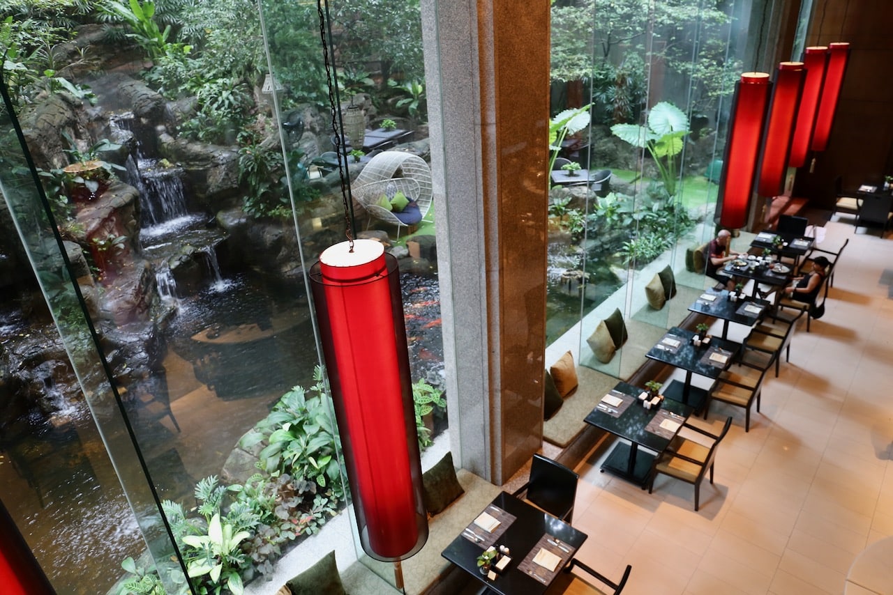 All day dining restaurant Romsai offers jaw-dropping views of a waterfall, tropical garden and koi pond. 