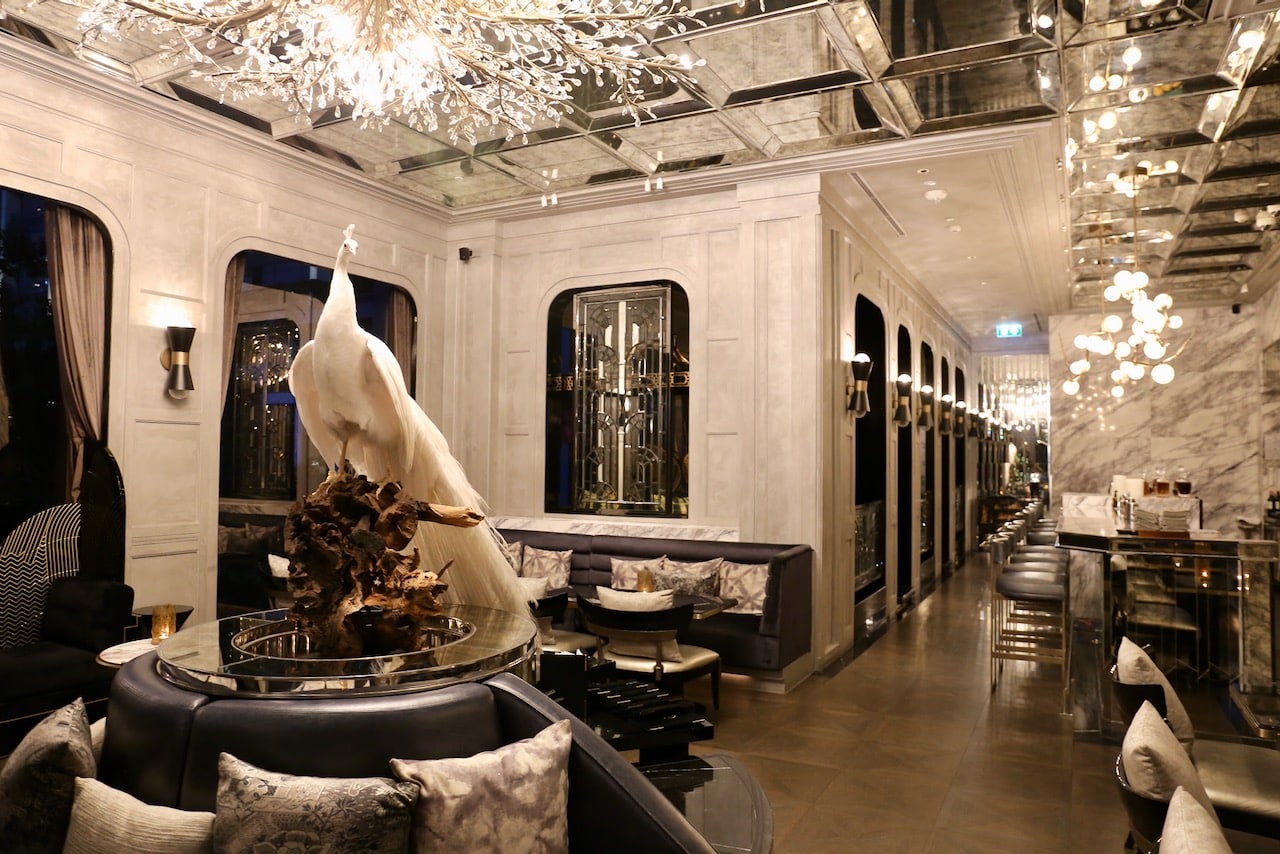 Capella's flamboyant stuffed white peacock at its famed cocktail bar makes it a must on this Best Bangkok Gay Hotels Guide. 