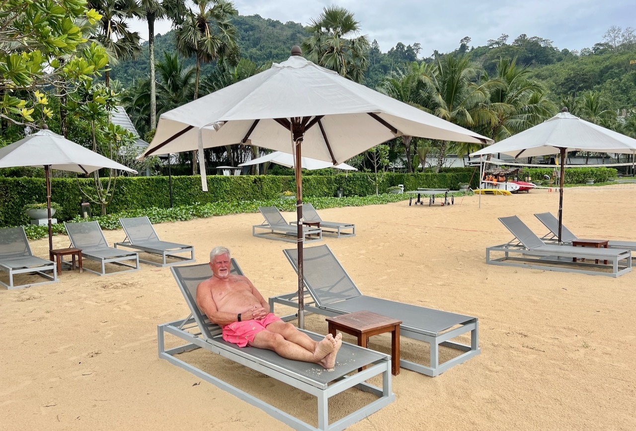 Phuket Marriott Resort Nai Yang is perched over a beach where guests can enjoy lounge chairs, volleyball and fun water sports like paddle boarding and kayak.