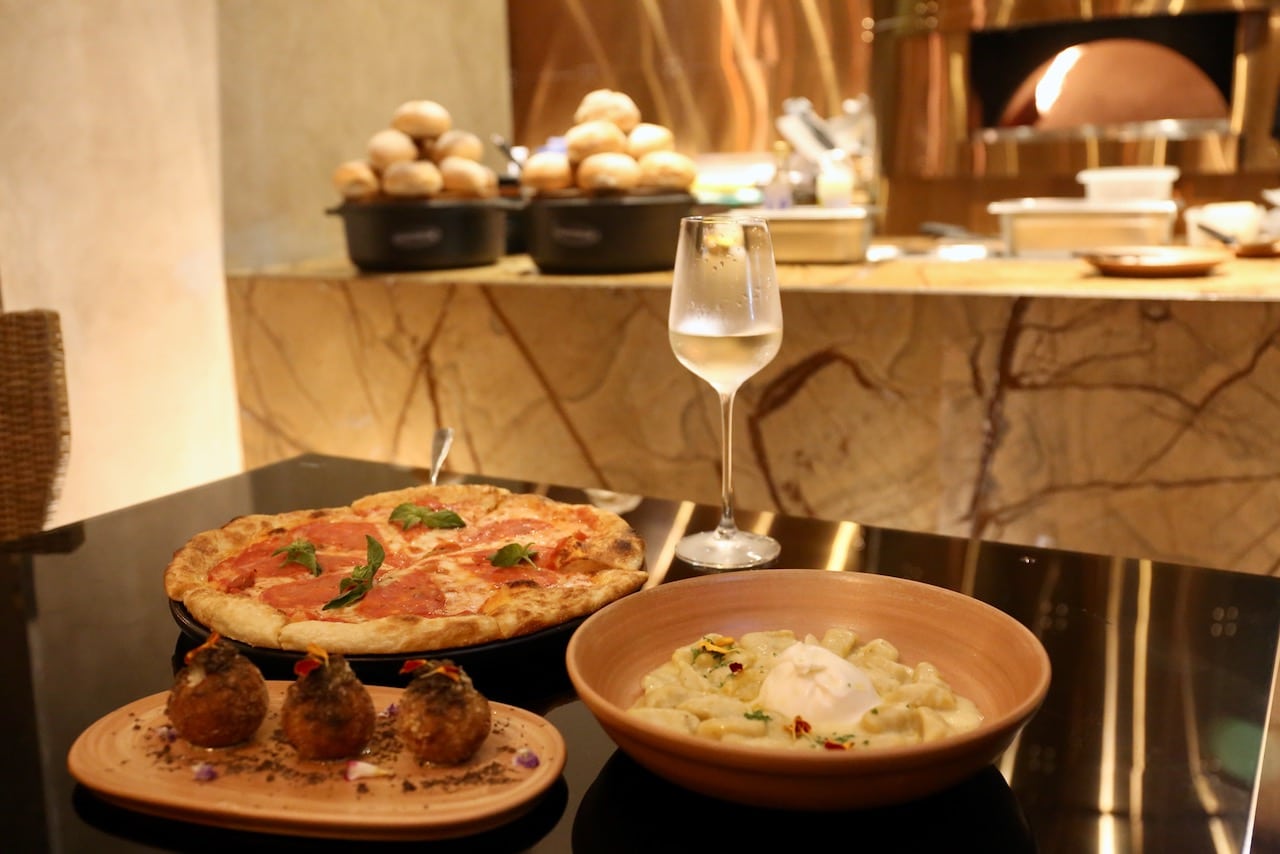 Arancini, gnocchi, pizza and fine Italian wine make for a romantic dinner at Favola Restaurant. 