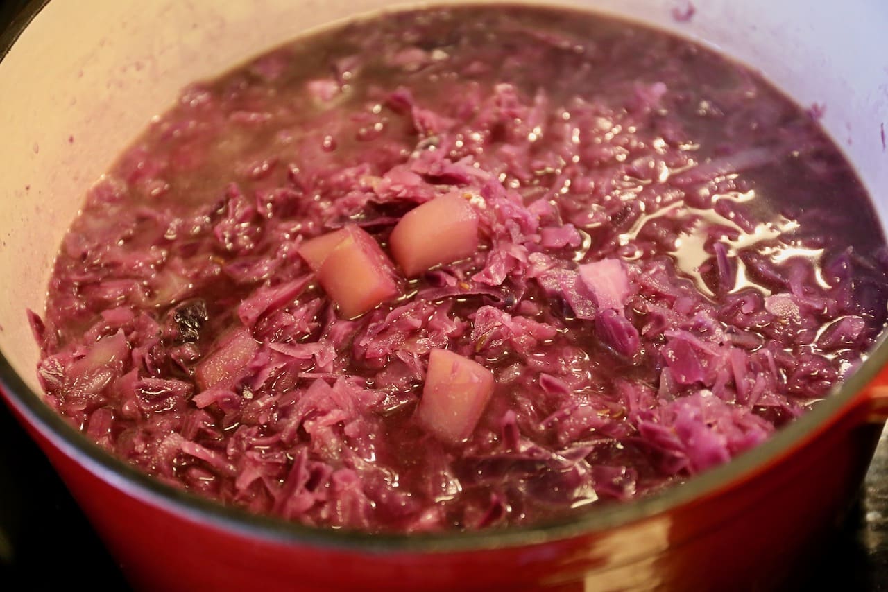 In a large pot simmer the broth and vegetables until they're tender.