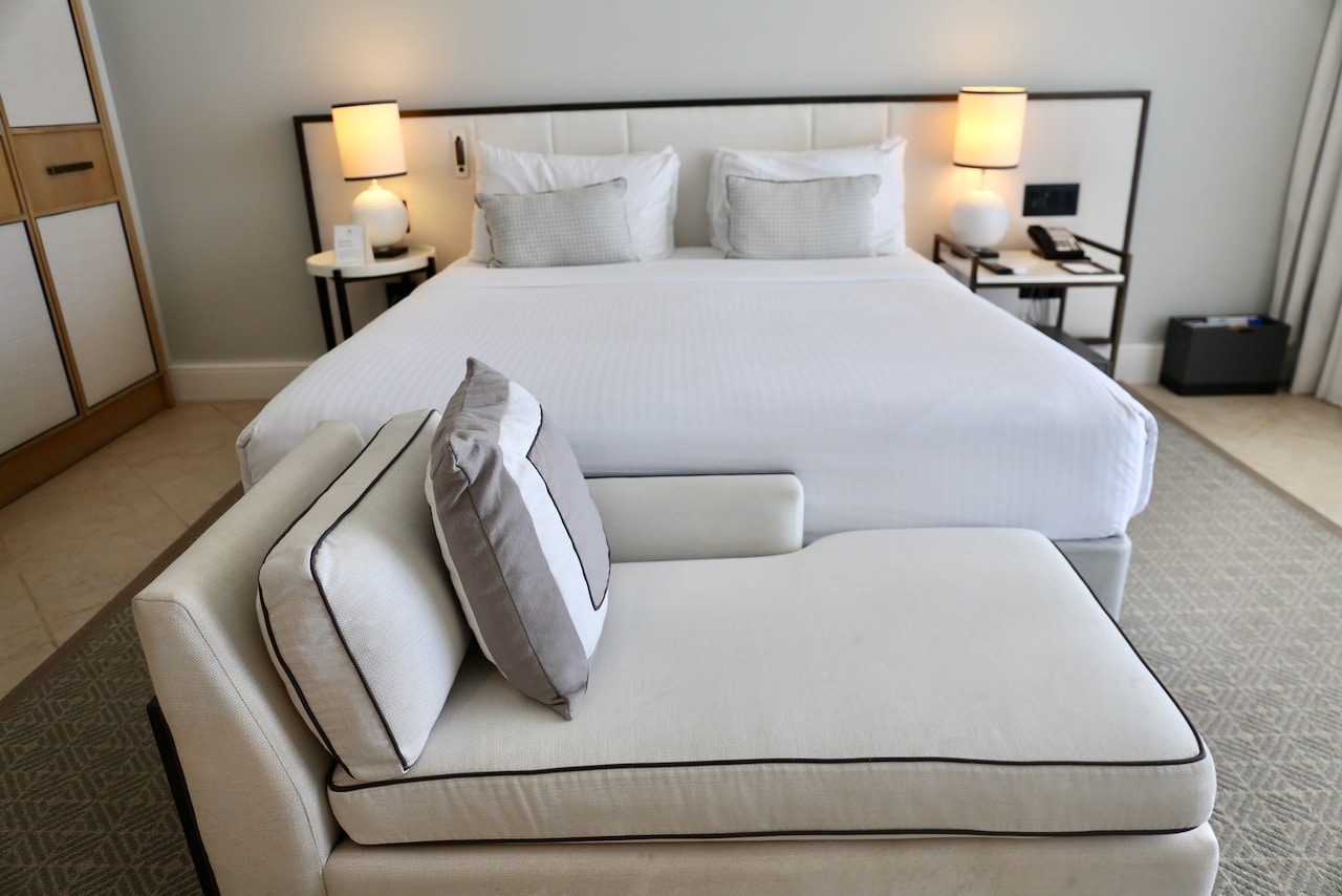 Chic bedroom in a suite at Fairmont Barbados.