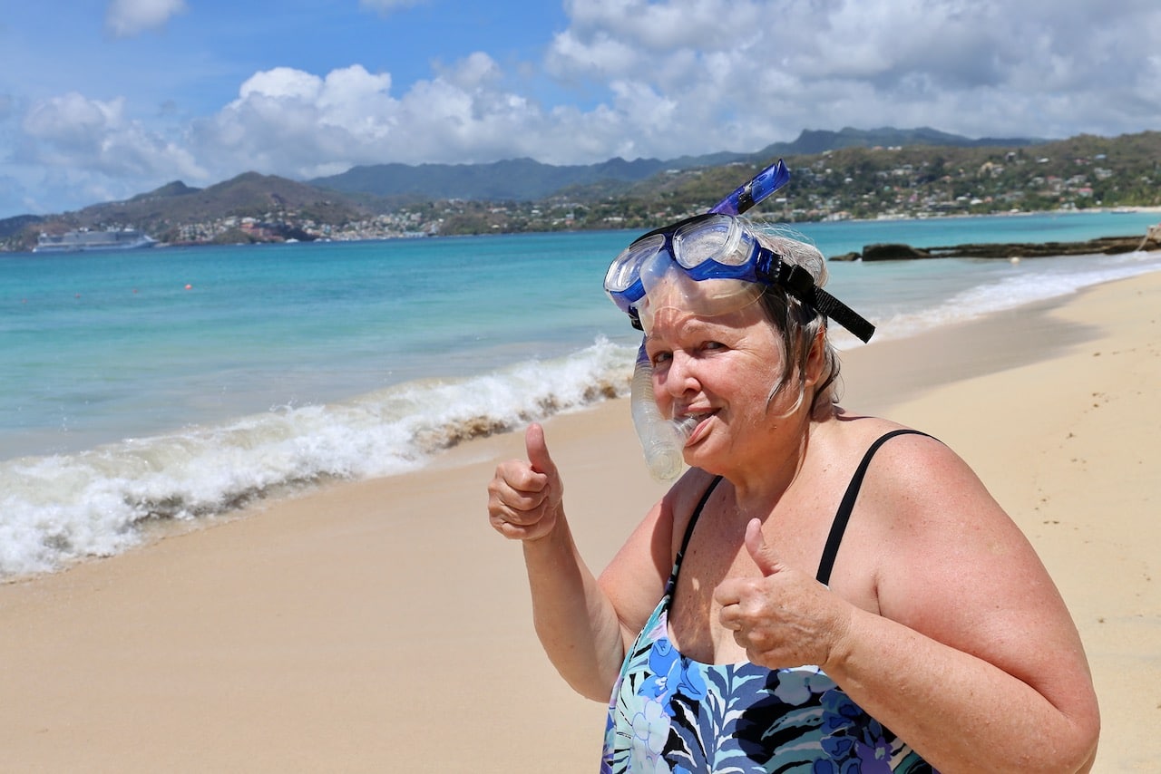 Mount Cinnamon Resort overlooks a soft sandy beach, perfect for snorkeling.