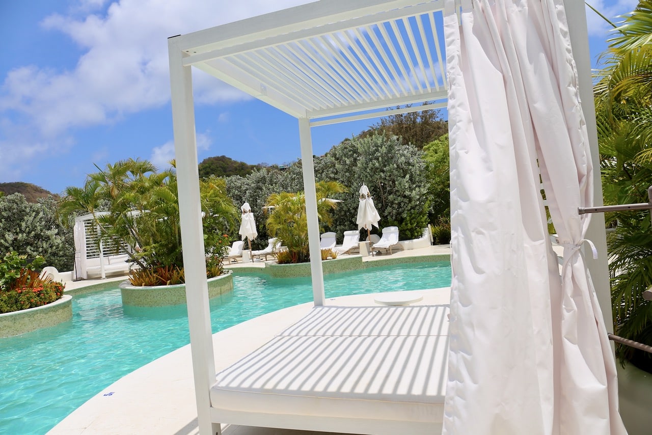 Spice Island Beach Resort in Grenada has a lagoon-style swimming pool with cabanas and sun loungers.