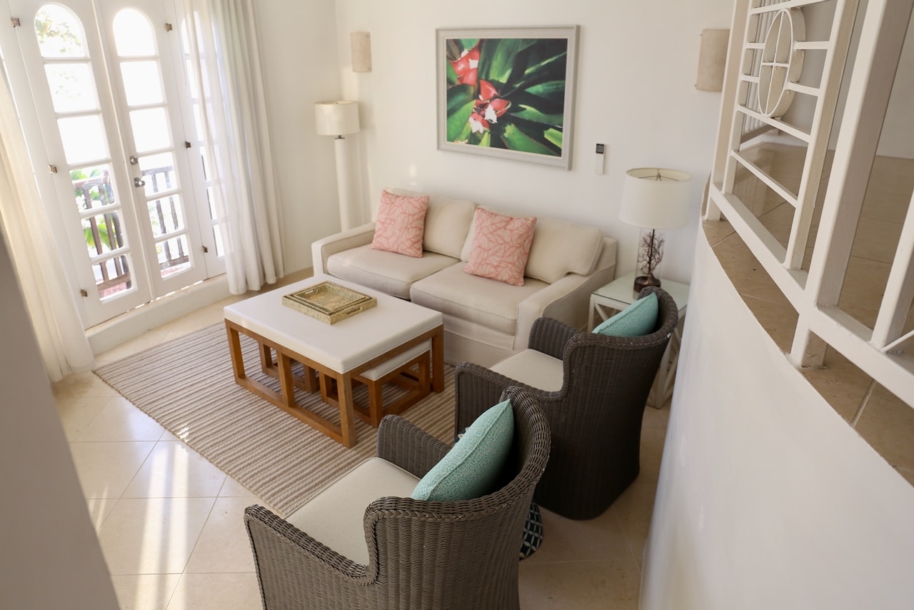 Enjoy views of the sunset from a spacious living room in your villa.