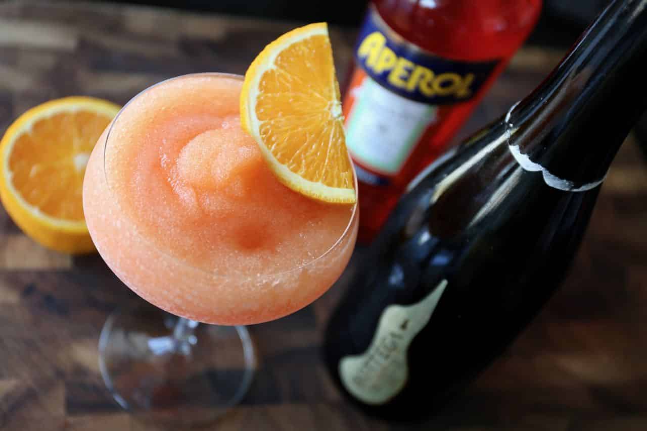 Garnish Frozen Aperol Spritz with a slice of orange.
