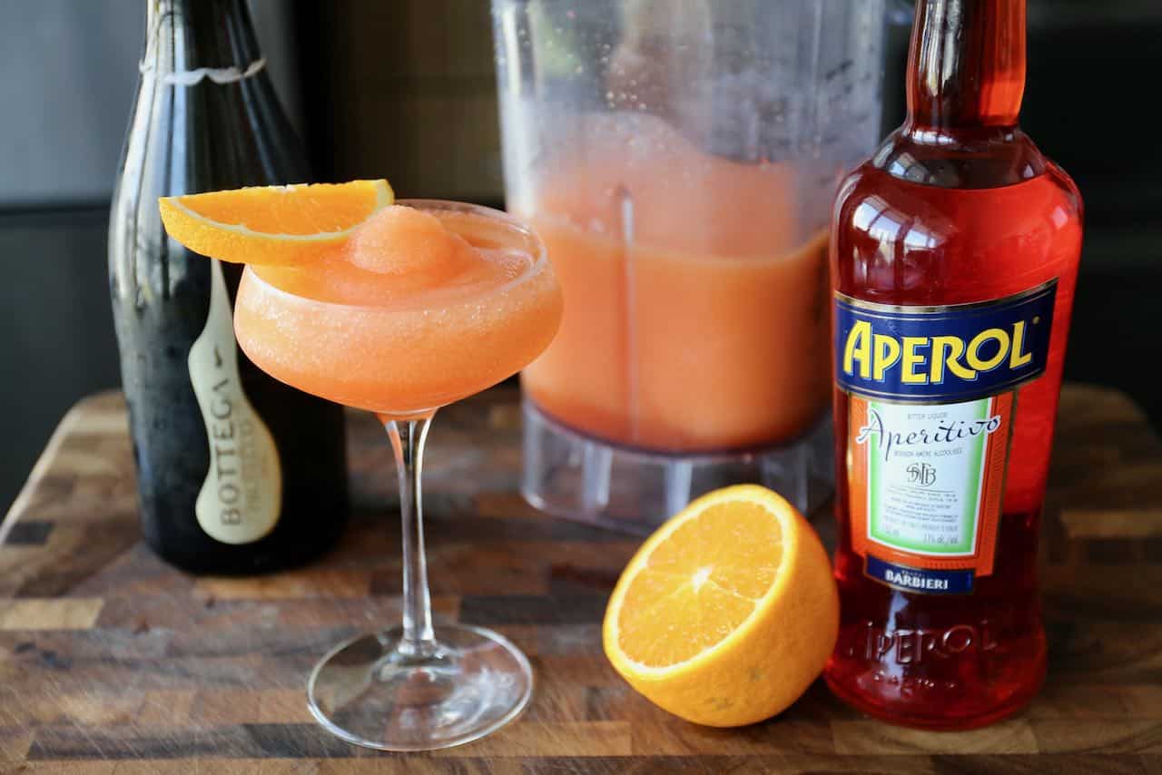 Serve this Aperol Slushie recipe in an elegant coupe glass.