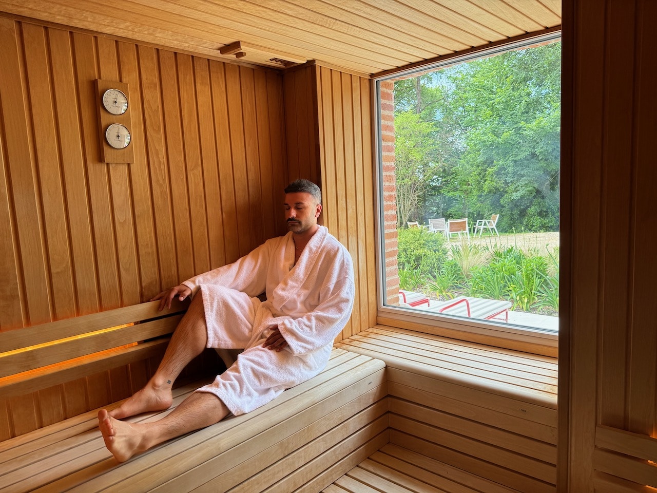 Chateau de Fiac's spa features a Swedish sauna with a window overlooking the garden.