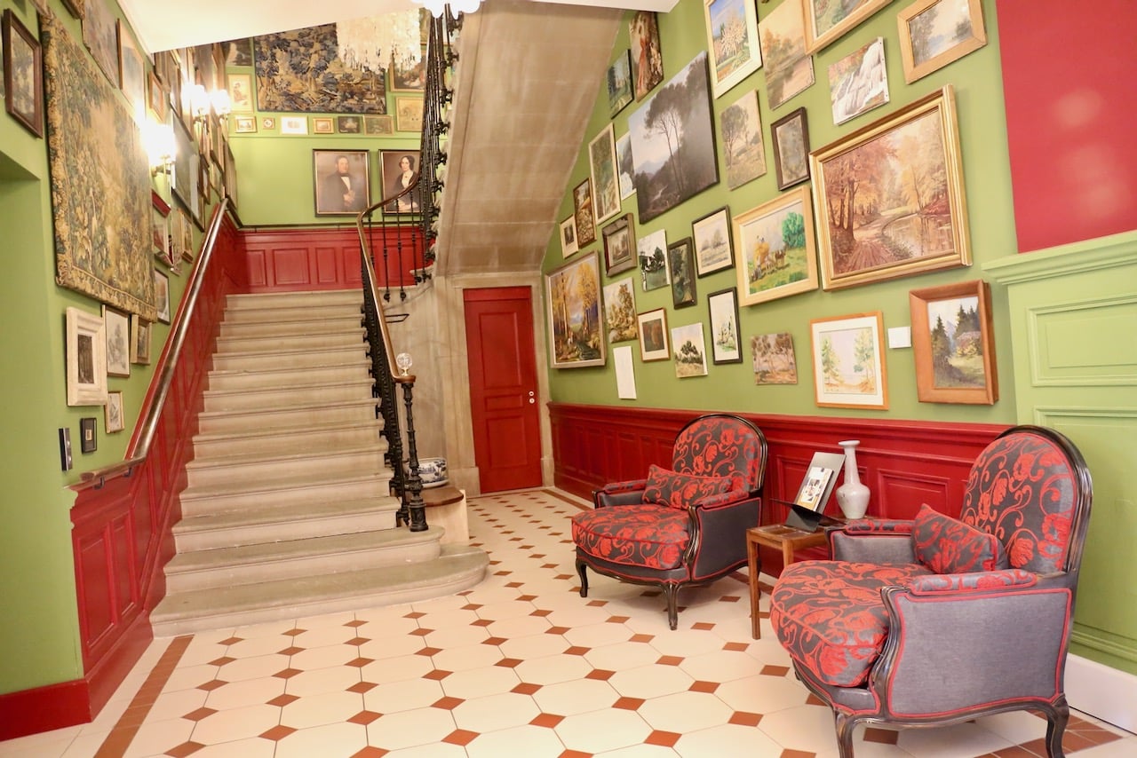 Chateau de Fiac lobby is covered in pretty paintings. 