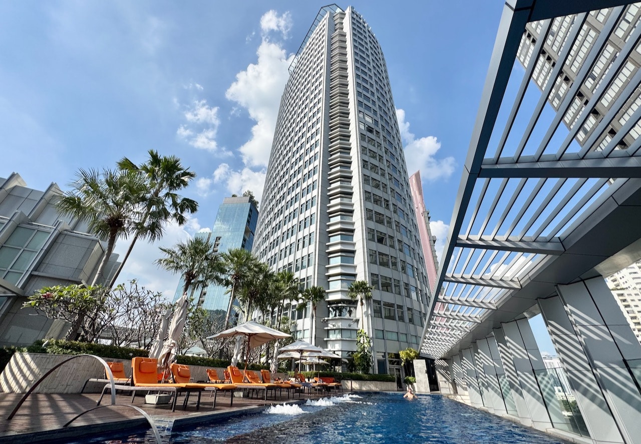 The hotel's rooftop pool features plenty of lounge chairs and bar service. 