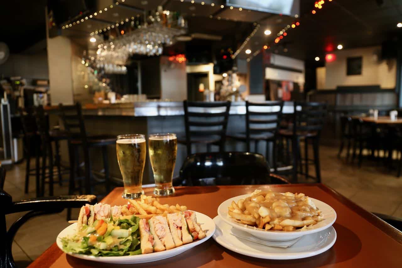 Lobster Club Sandwich and Poutine at Bistro-Bar Le Brise Bise in Gaspe.