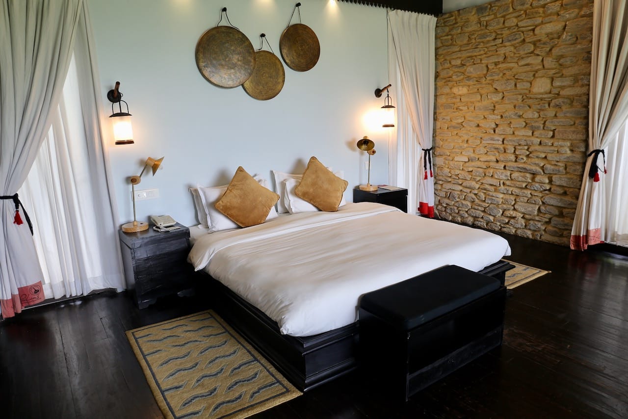 Bedroom in a luxurious villa at The Pavilions Himalayas The Farm.