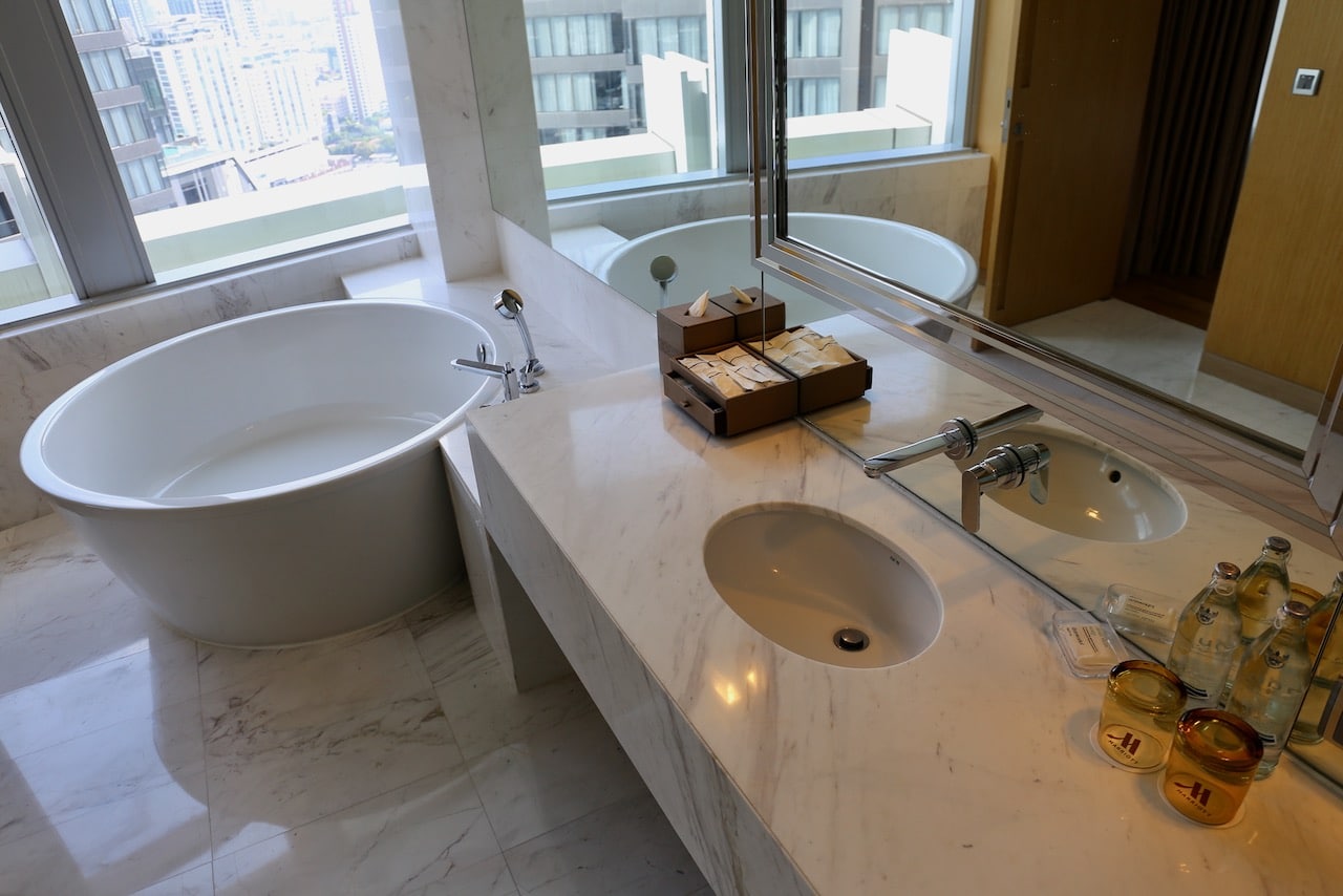 The bathroom features an oversized ramen bowl-shaped tub.