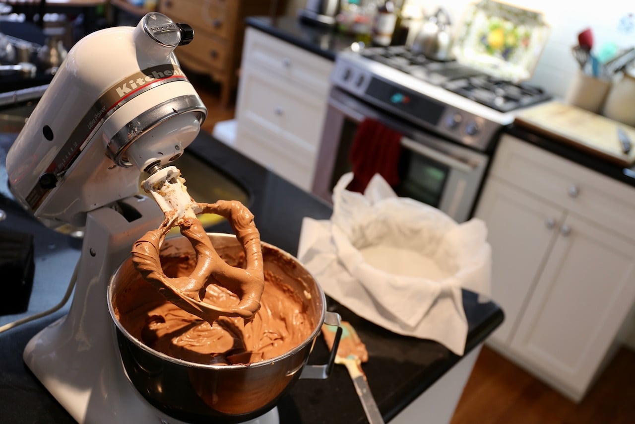 Prepare the batter in a stand mixer then pour into a parchment lined cheesecake springform pan.