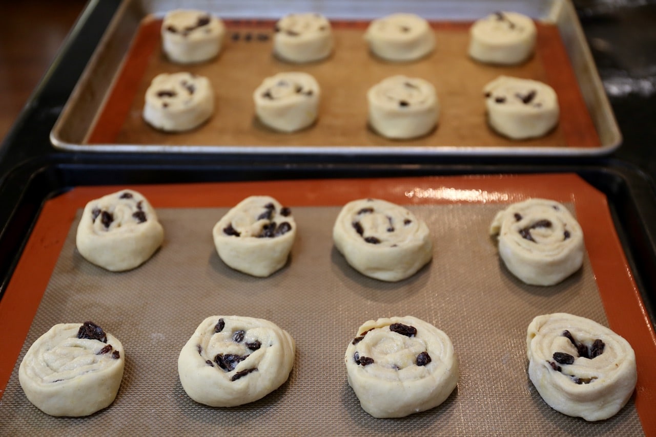 Roll dough into a log, slice into spiral shape and place on baking sheet.