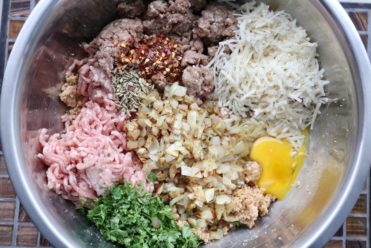 Combine the meatball ingredients in a large mixing bowl.
