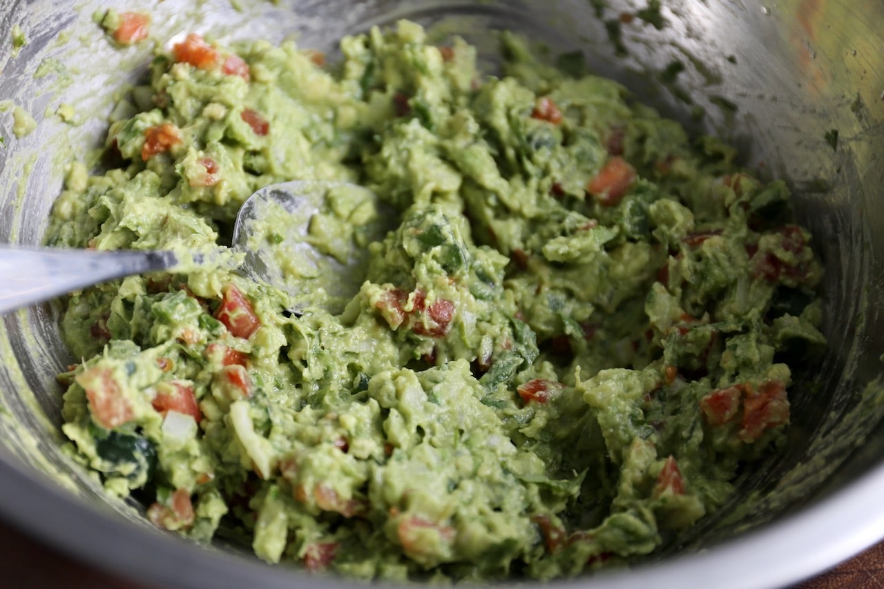 Combine all of the guacamole ingredients in a large mixing bowl.
