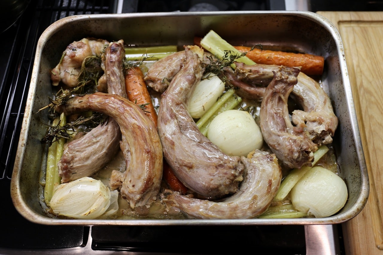 Roast the turkey necks, vegetables and herbs in the oven for 1 hour.