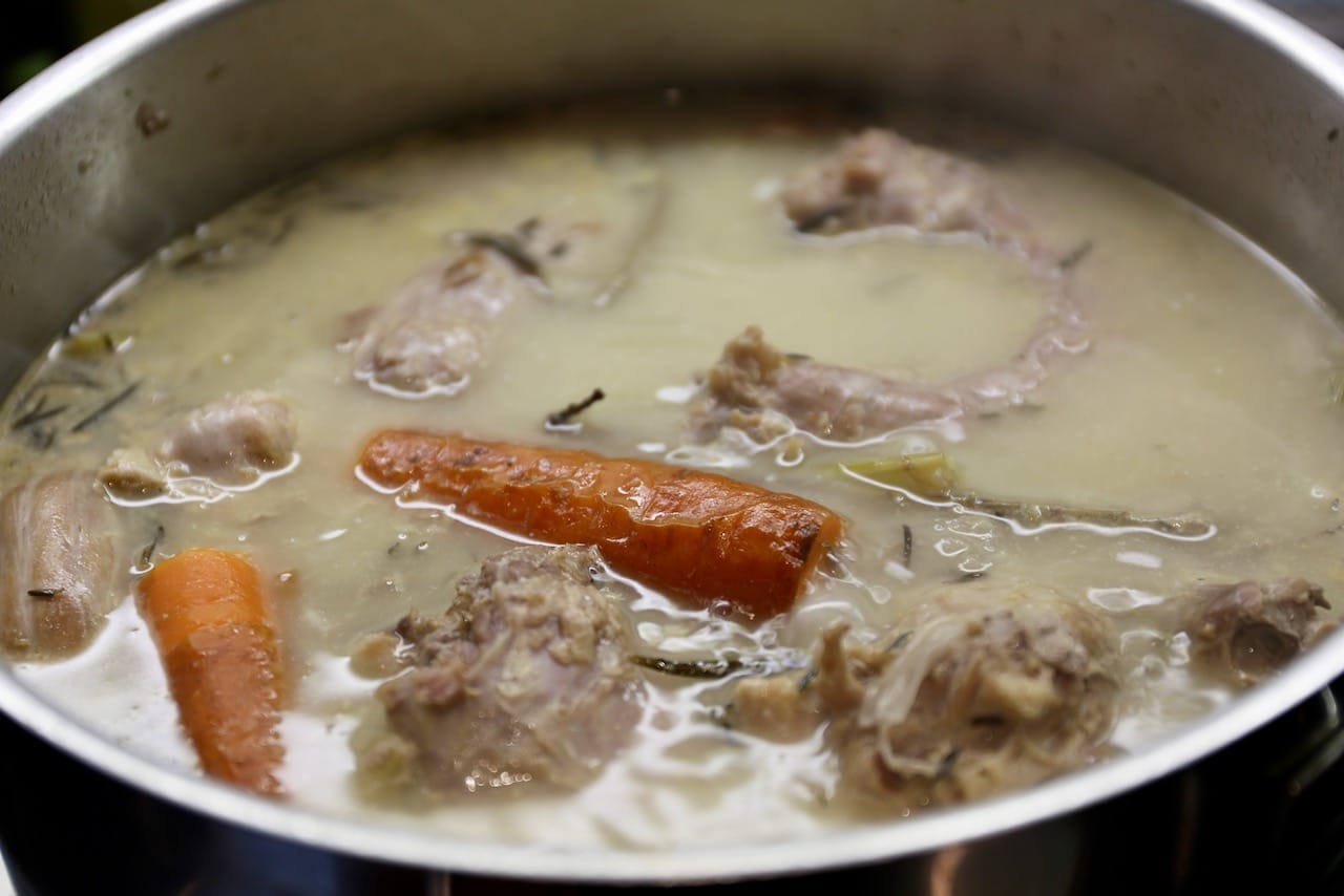 Simmer the turkey stock in a large pot for 2-3 hours.
