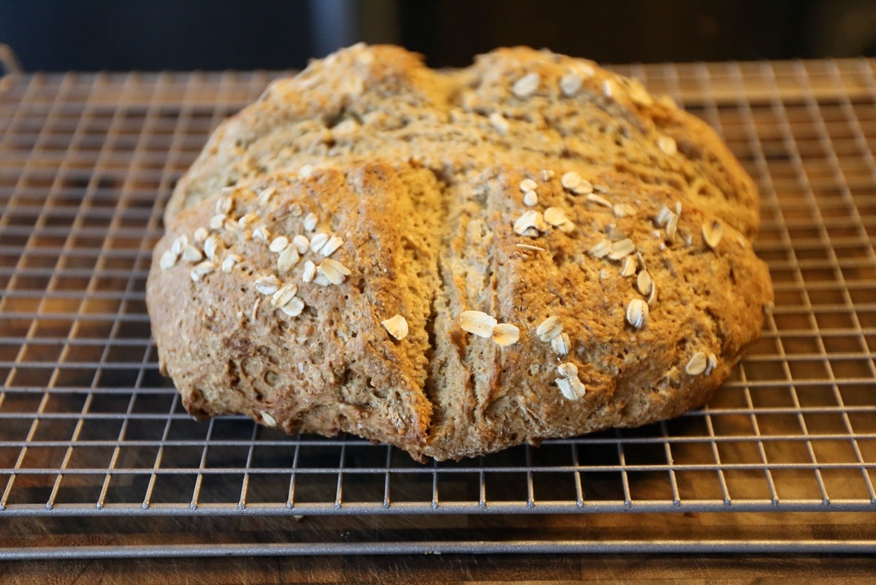 Bake Irish Soda Bread until browned on the outside with a crunchy exterior then rest on a cooling rack before slicing.