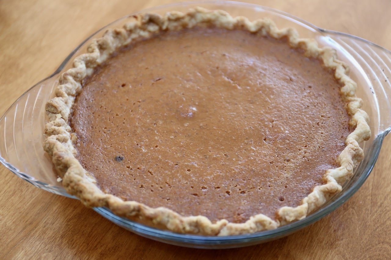 This recipe features a flaky pie crust and soft pumpkin spice custard filling flavoured with maple syrup.