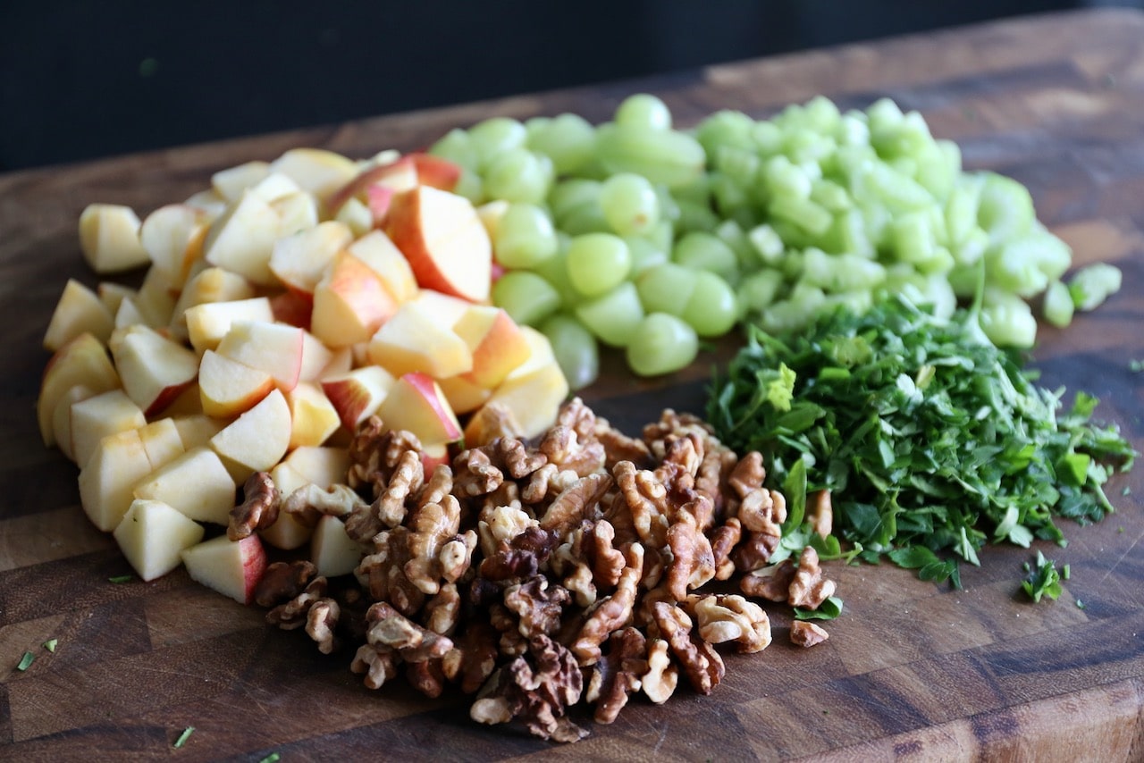 Chop apple, grapes, toasted walnuts and parsley.