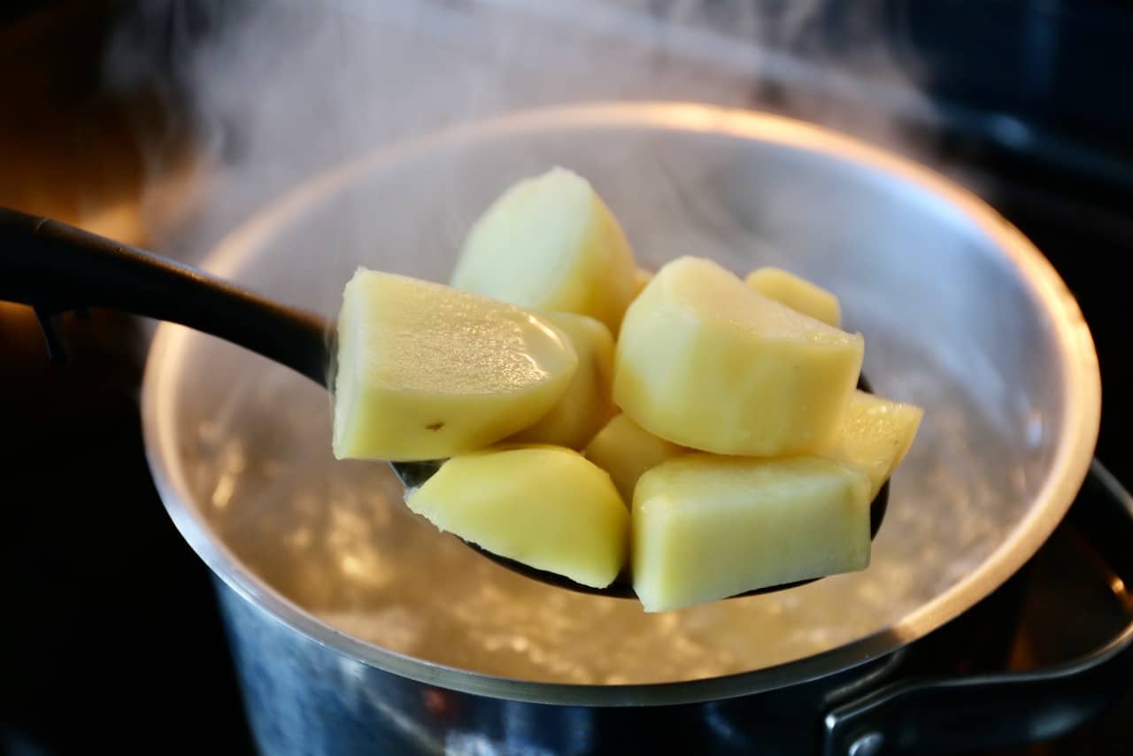 Boil potatoes for 5 minutes then strain.