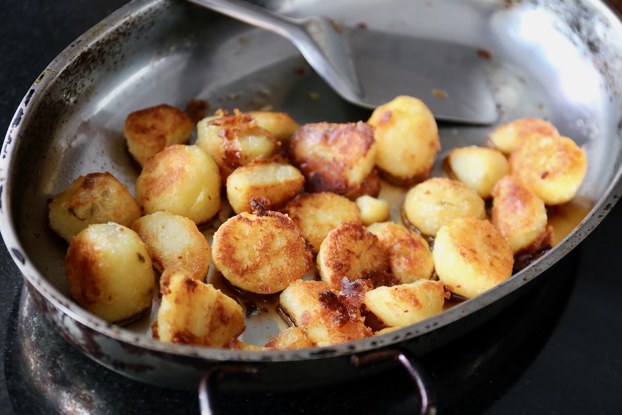 Perfect Roast Potatoes are finished cooking when crispy browned, which takes around 45 minutes in a hot oven.