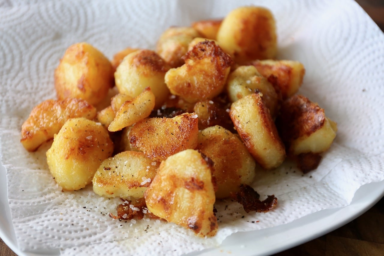 Drain roasted potatoes on a paper towel and sprinkle with salt and pepper.