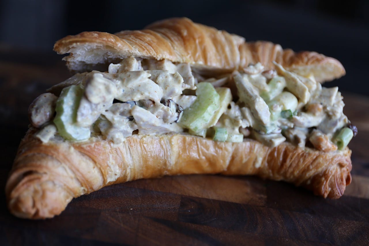 The best Curry Chicken Salad Sandwich is served on a flaky croissant.