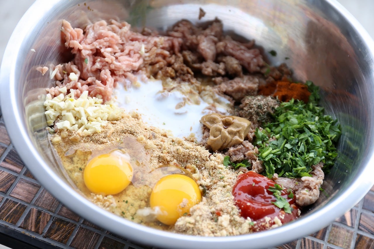 Combine the meatloaf ingredients in a large mixing bowl.