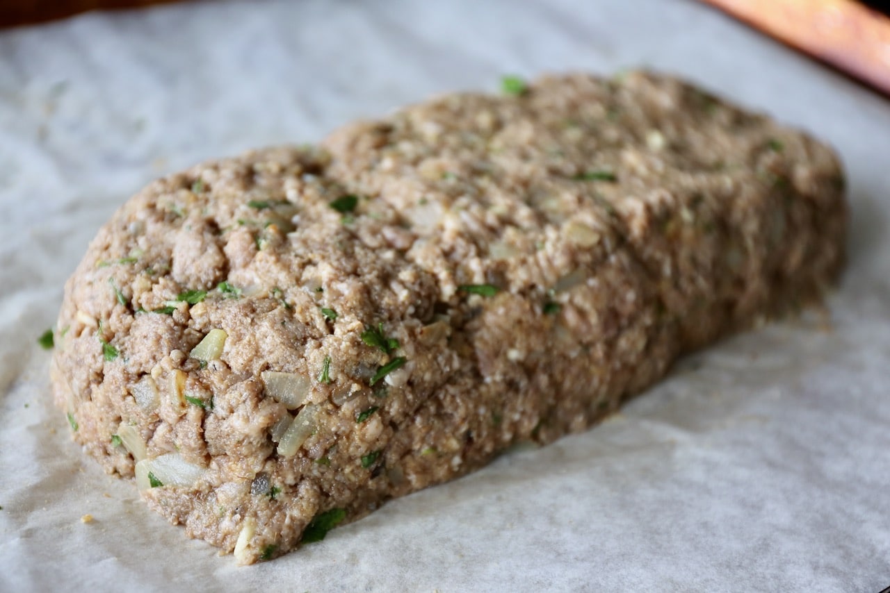 Shape the meatloaf onto a parchment lined baking sheet.