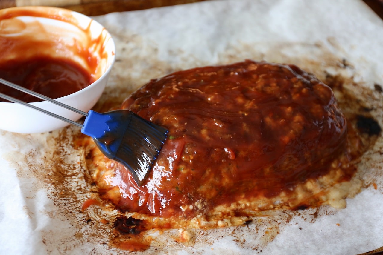 Brush sweet glaze over partially cooked meatloaf near the end of the cook time to avoid burning.