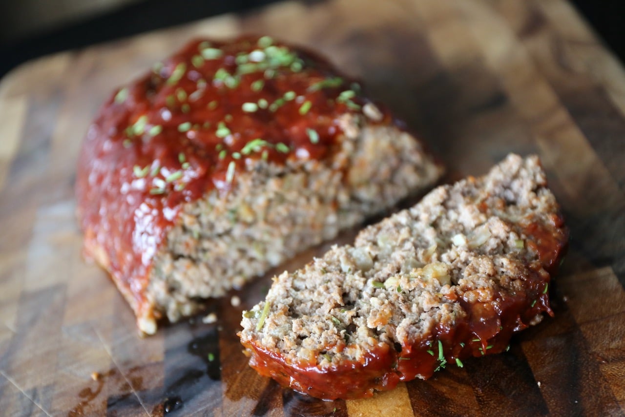 Slice glazed meatloaf using a sharp knife and serve hot.