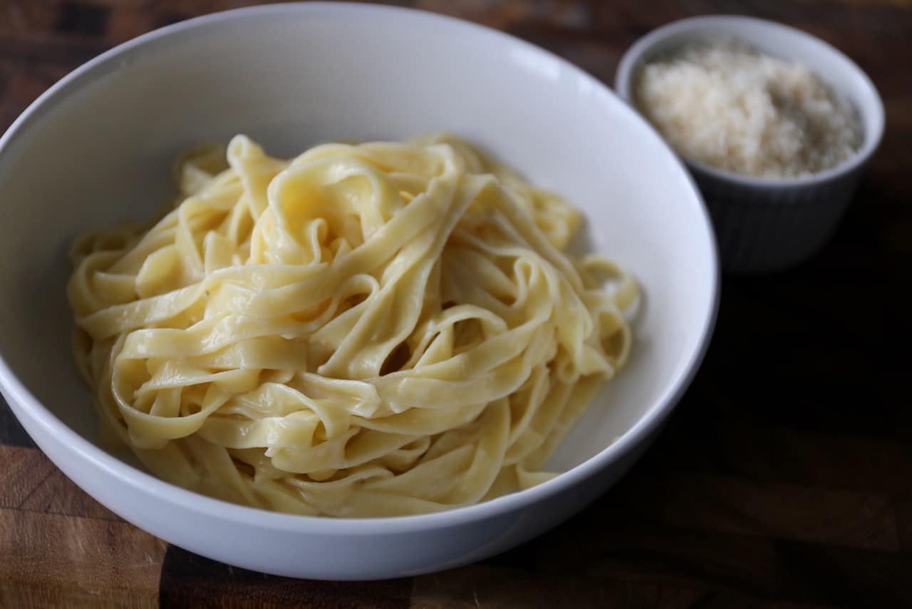 Serve classic Italian Butter Noodles with parmesan cheese.