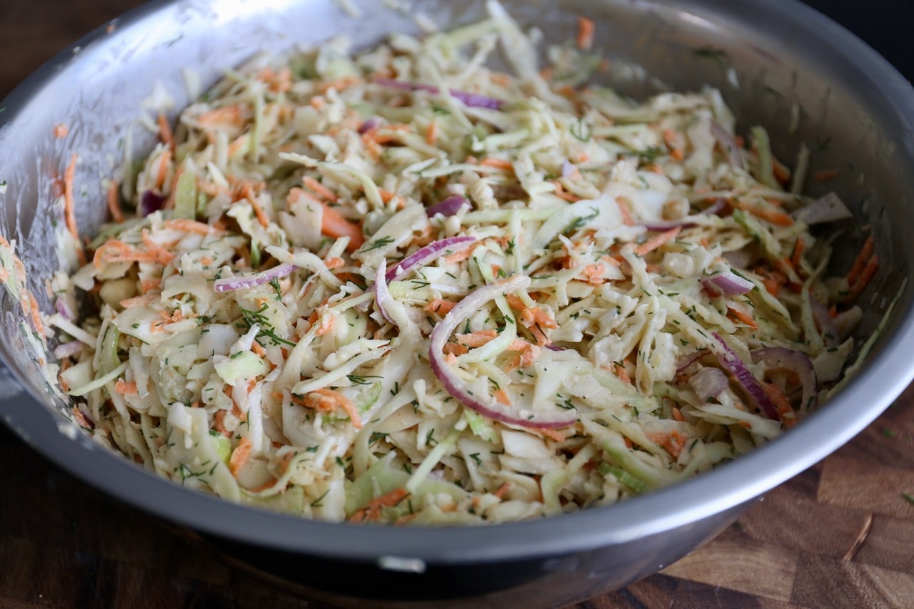 Toss vegetables in dressing until combined.